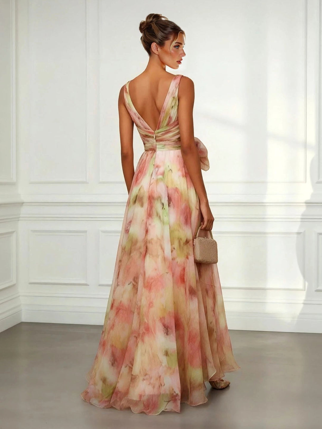 Flowy women's abstract print maxi dress, featuring a colorful design, V-neck, and stylish tie-waist.