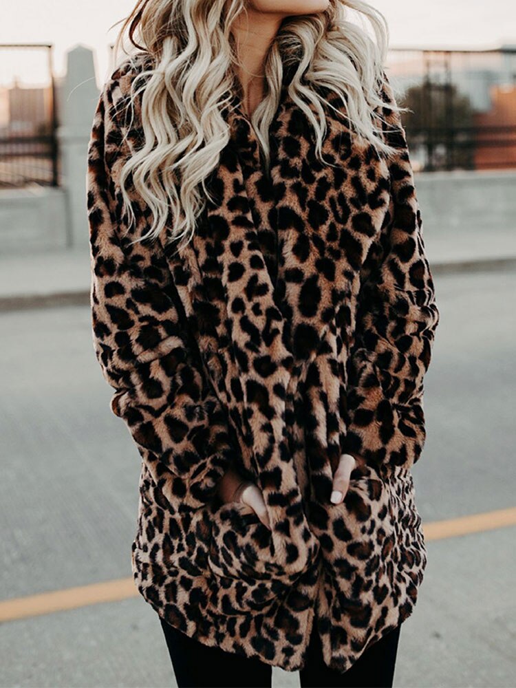 Trendy women's leopard print winter coat, a chic statement piece for bold fashion and warm outerwear in cold weather.