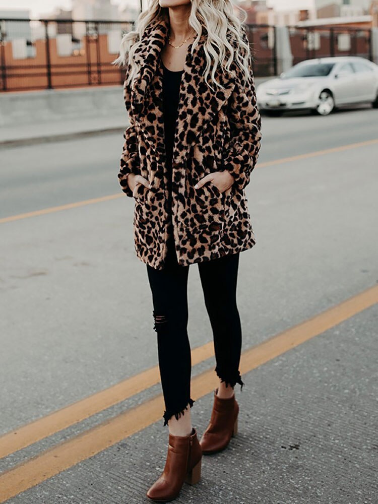 Fashionable women's leopard print winter coat, a chic and warm jacket perfect for trendy outerwear and winter apparel.