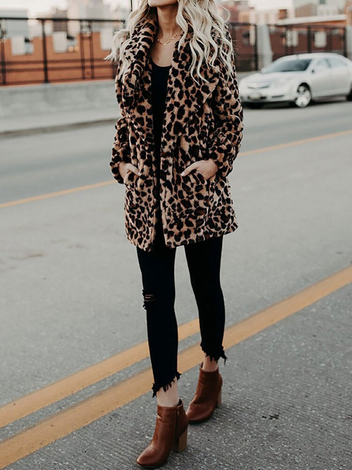 Fashionable women's leopard print winter coat, a chic and warm jacket perfect for trendy outerwear and winter apparel.