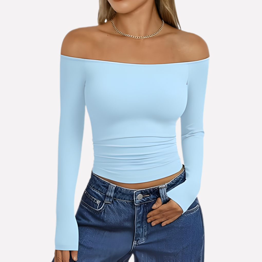 Fashionable women's off-shoulder long sleeve blouse, relaxed fit, a chic addition to spring/fall wardrobes.