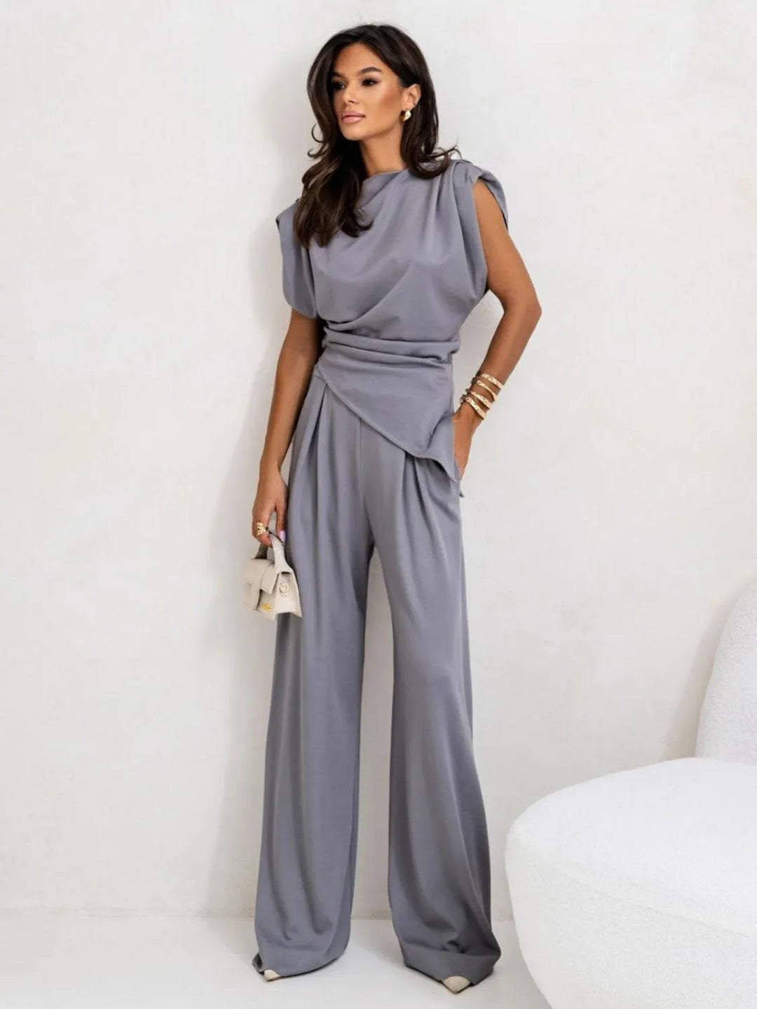 Fashionable women's matching set with asymmetrical top and wide leg pants