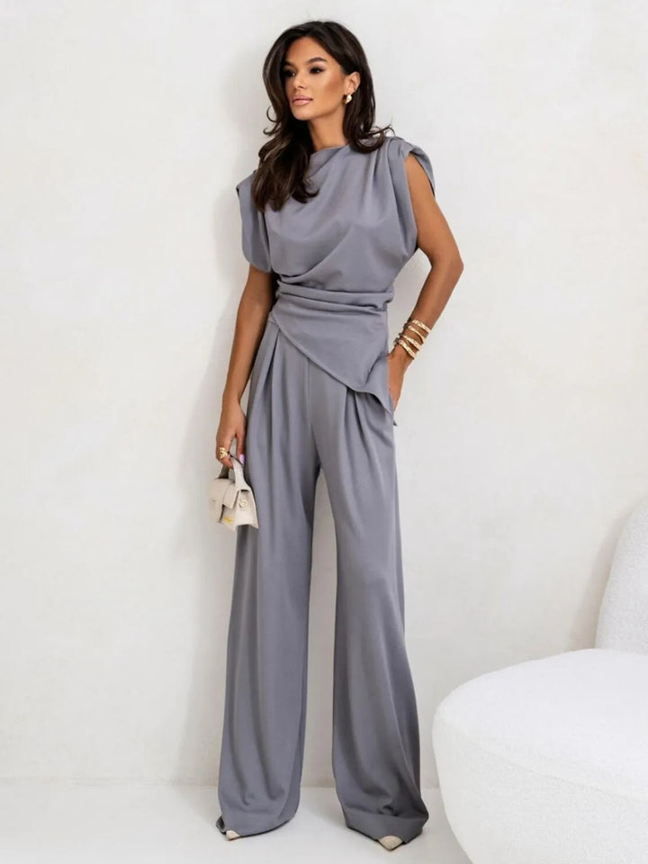 Fashionable women's matching set with asymmetrical top and wide leg pants