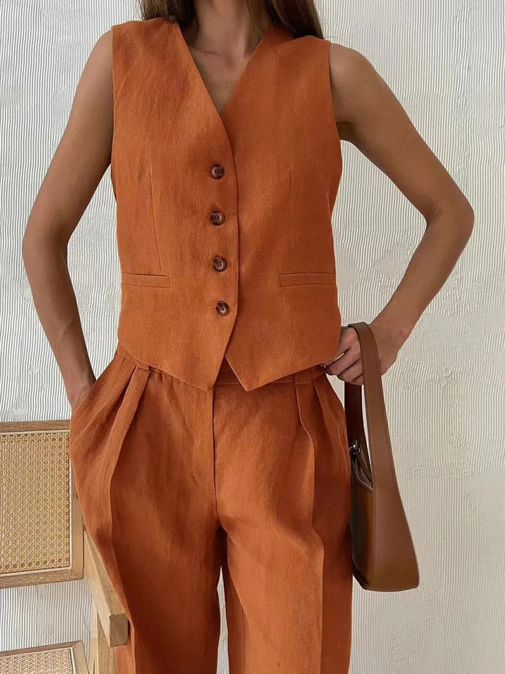 Elegant beige cotton linen two-piece set with wide-leg trousers and matching top.