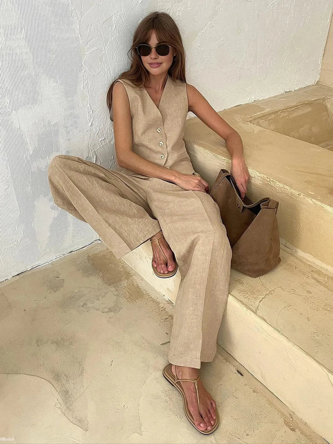 Close-up of the textured cotton linen fabric on a women's summer two-piece set.