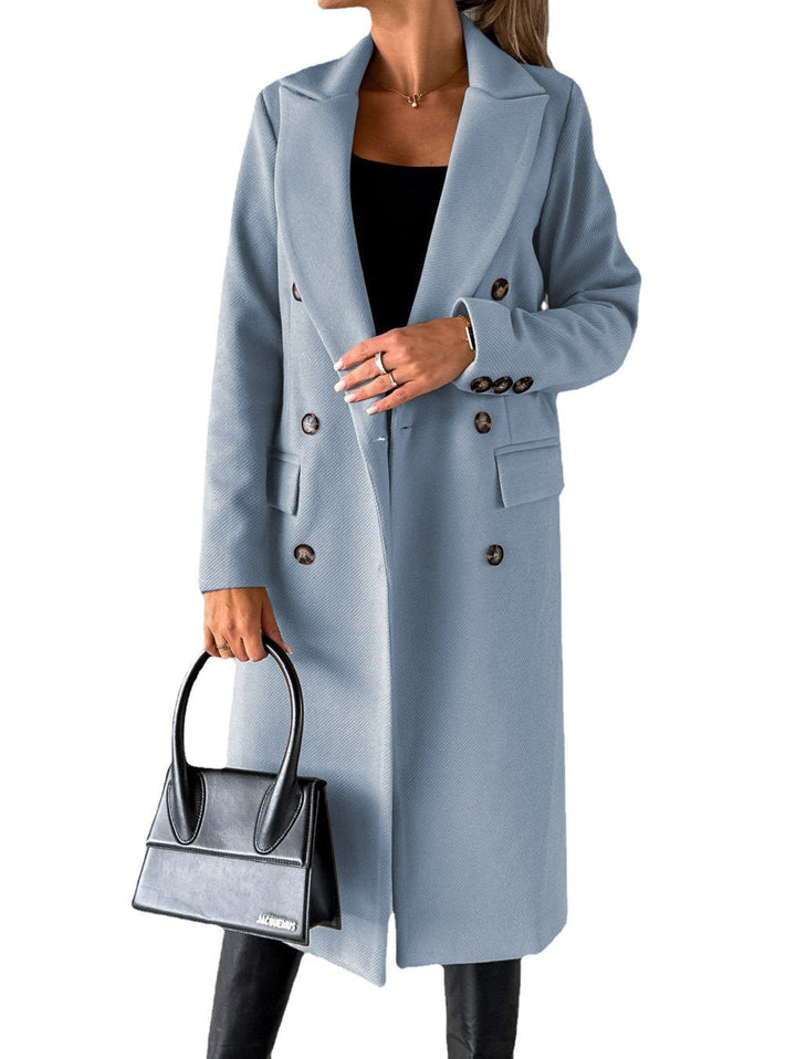 Modern blue ladies' long oversize winter coat, blending comfort with chic urban style.