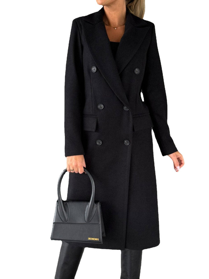 Trendy blue women's oversized long winter coat, offering warmth and a modern urban look.