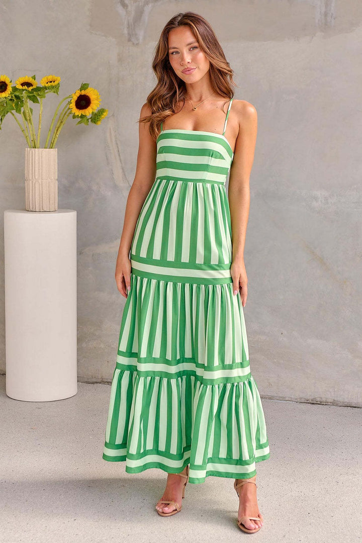 Fashionable women's striped sundress, perfect for a casual yet sophisticated summer vibe.
