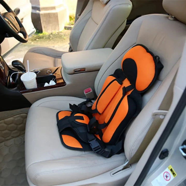 Secure children's portable car seat with a 5-point safety harness, foldable for travel.