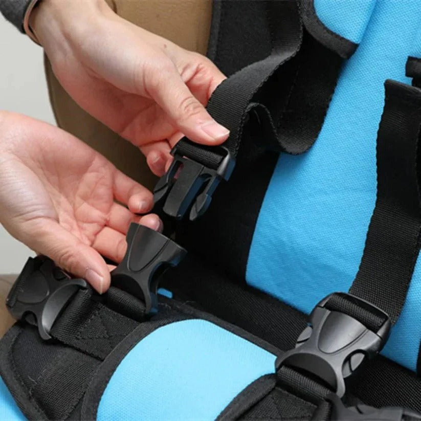 Easy-to-use foldable children's car seat, portable travel accessory with safety harness.