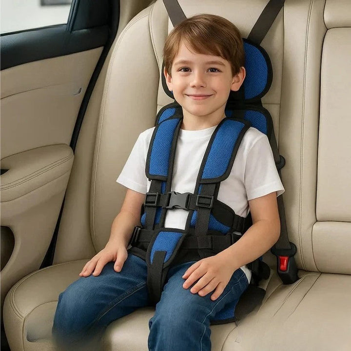 Kids travel car seat, portable & foldable with safety harness for road trips.