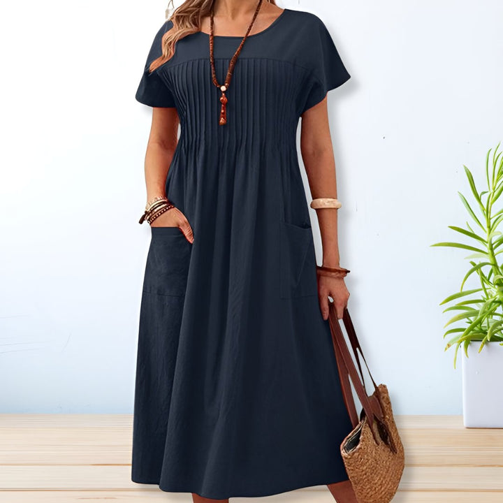 Flowy women's relaxed fit day dress for modern chic summer style. Lightweight & comfortable for daily wear.