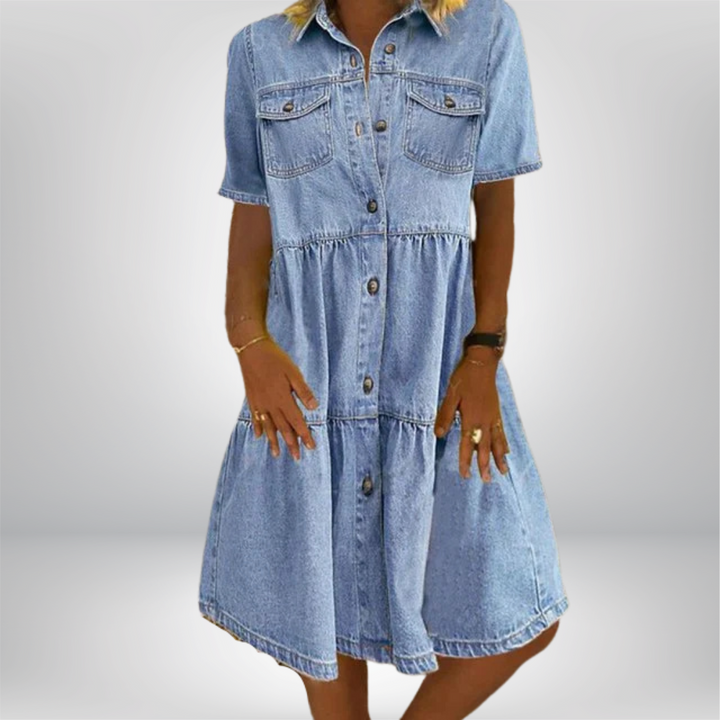 Chic women's short sleeve shirt dress. Features a button-front, tiered skirt, and collar for a relaxed summer look.