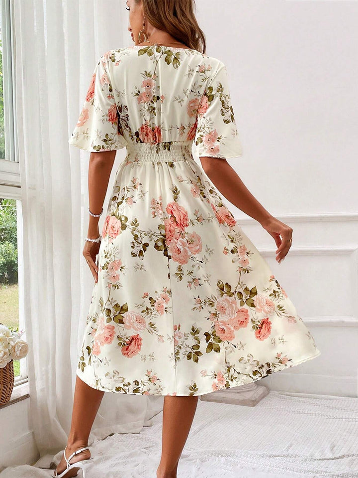 Elegant women's floral A-line midi dress with flutter sleeves, ideal for garden parties or brunch.
