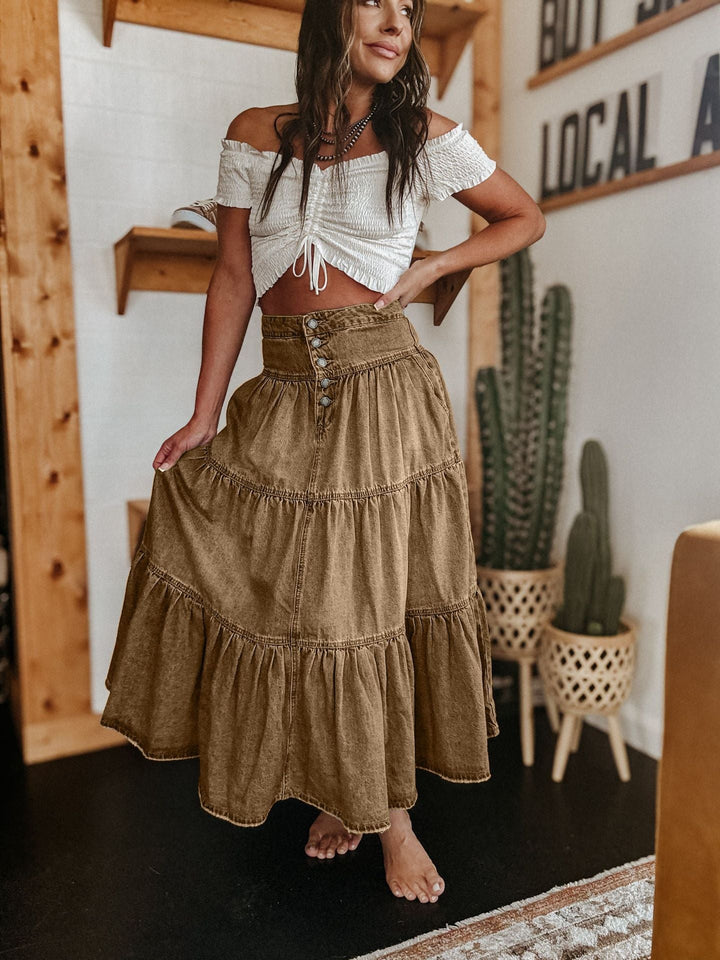 Stylish women's summer midi skirt. Tiered and button-front design offers versatile, graceful bohemian appeal.