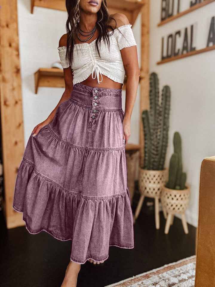 Flowy bohemian women's tiered skirt. Elegant button-front midi for comfort and style in spring/summer.