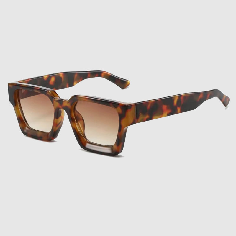 Fashionable chunky square frame sunglasses with trendy tinted lenses, offering a unisex eyewear look.