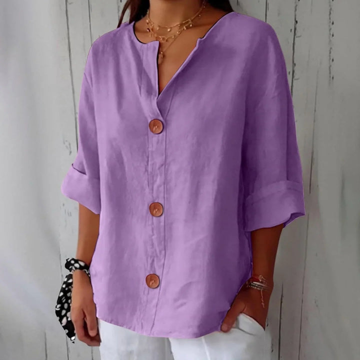 Soft three-quarter sleeve women's oversized top, a cosy button-front blouse.