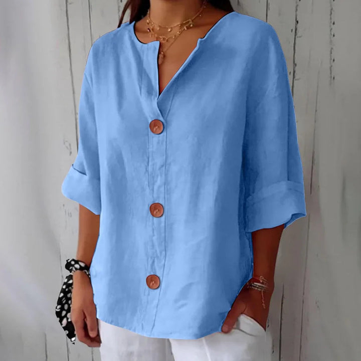 Everyday women's button-front blouse, an oversized & comfortable three-quarter sleeve top.