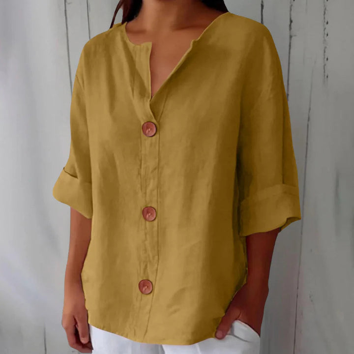 Women's comfortable oversized button-front top, a versatile spring/summer blouse.