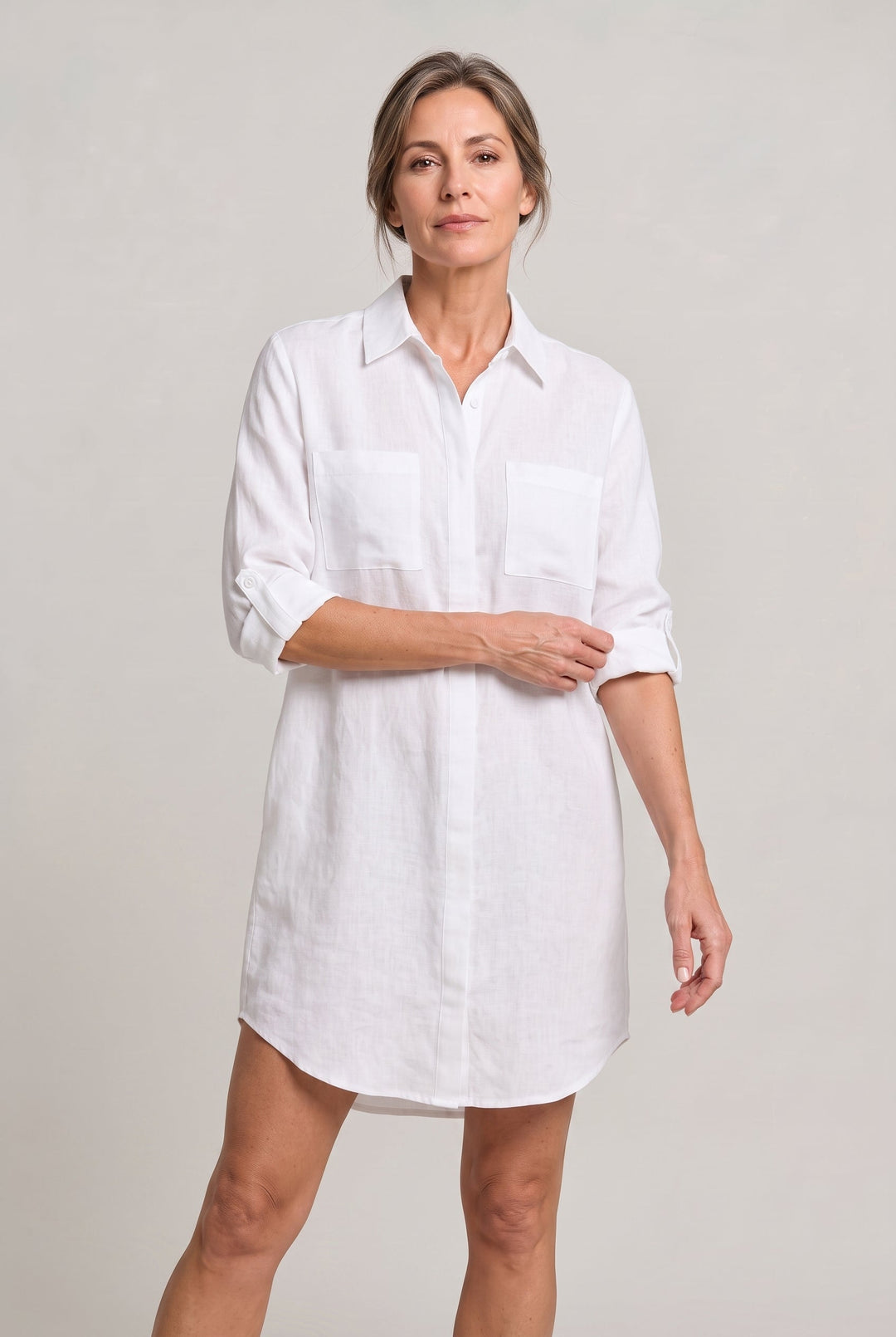 Chic women's oversized button-down shirt dress. A versatile long-sleeve design for summer or beach.