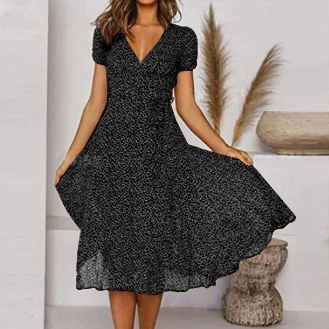 Elegant women's midi dress with a V-neck and beautiful A-line flowing skirt. Chic for autumn fashion.