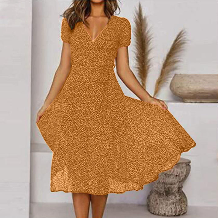 Stylish women's V-neck midi dress with an A-line flowing skirt, perfect for elegant autumn fashion.