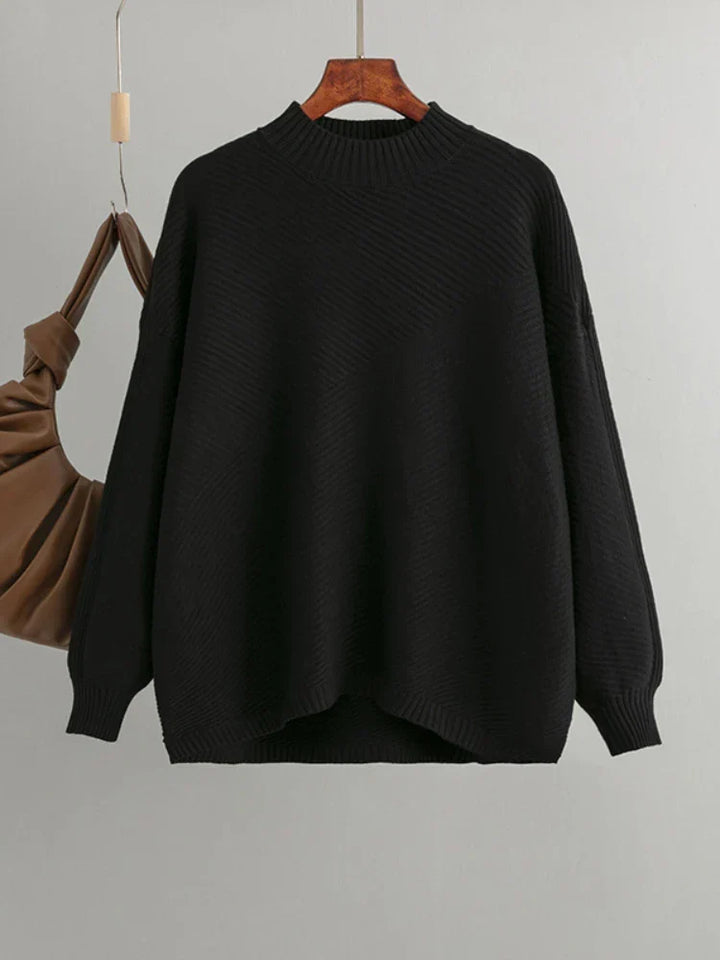 Comfortable women's oversized ribbed sweater, a timeless style essential for versatile everyday outfits.