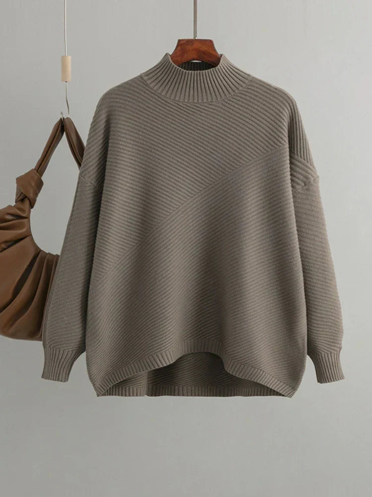 Women's classic ribbed knit jumper in an oversized fit, offering effortless style & comfort for everyday wear.