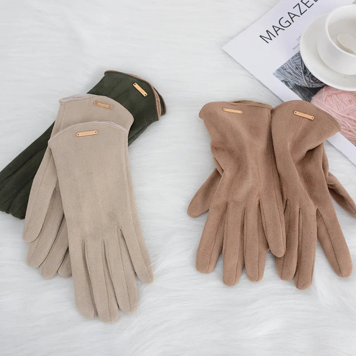 Fashionable women's suede gloves, a chic winter accessory with touchscreen ability.