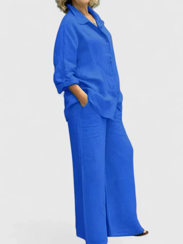 Navy women's stylish two-piece set: button-down shirt & wide-leg pants. Comfortable spring fashion for a coordinated look.