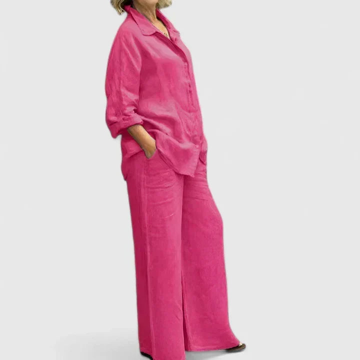Woman in a relaxed button-down shirt & wide-leg pants set, enjoying a casual summer day. Effortless style.