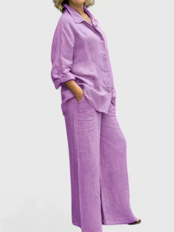 Back view of women's coordinated ensemble: relaxed fit button-down shirt & wide-leg pants. Versatile for everyday style.
