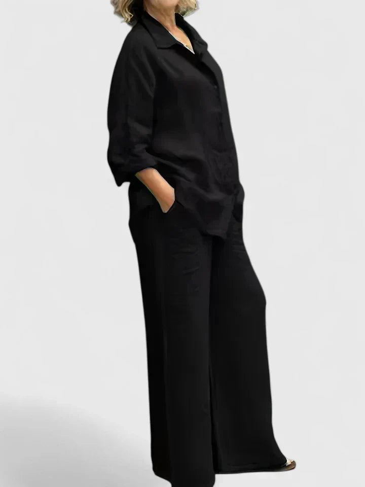 Women's relaxed fit button-down shirt from a two-piece set, paired with wide-leg pants for a chic look. Stylish set.