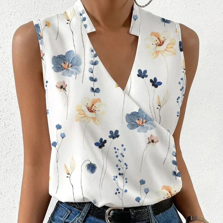 Woman wearing a comfortable floral V-neck sleeveless top, showcasing effortless summer fashion.