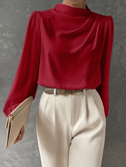 Model wearing a stylish women's bishop sleeve blouse, perfect for evening wear or daily fashion.
