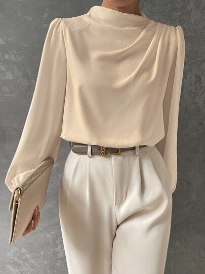 Versatile women's fashion top: a sophisticated bishop sleeve blouse with a draped front for chic style.