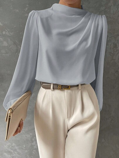 Elegant women's blouse with bishop sleeves, ideal for smart casual or evening occasions year-round.