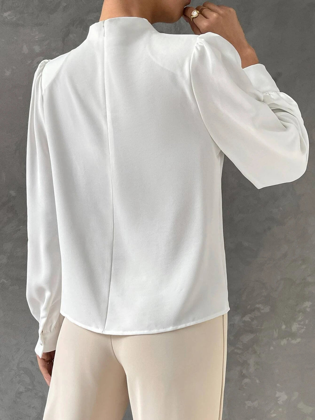 Sophisticated long sleeve women's blouse with chic bishop sleeves for versatile styling and comfort.