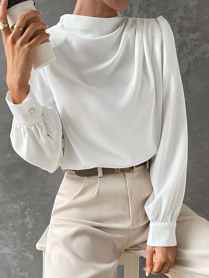 Smart casual women's top featuring elegant bishop sleeves and a flattering draped neckline design.