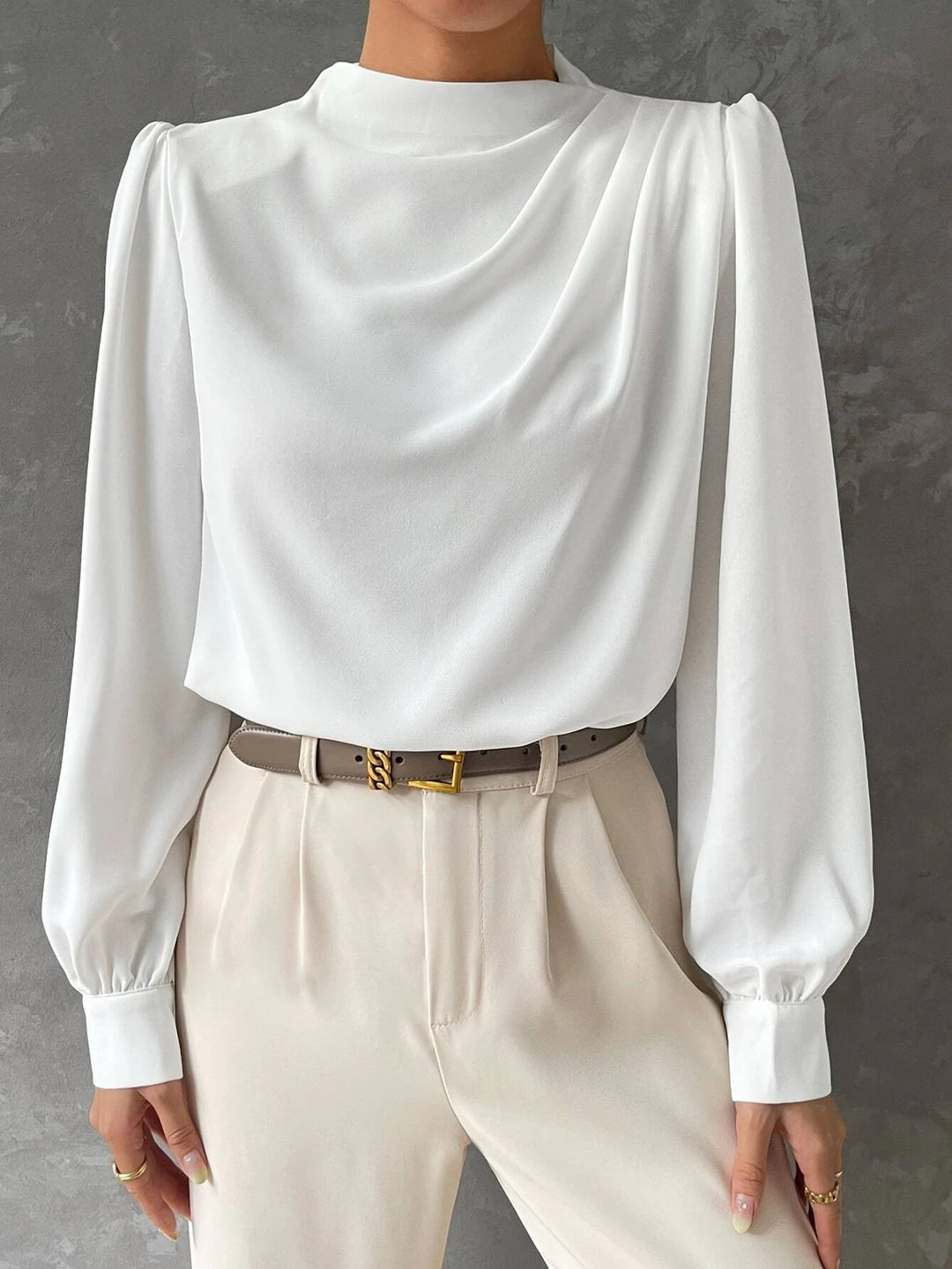 Flowy women's blouse with bishop sleeves, ideal for all-season wear and chic fashion looks.