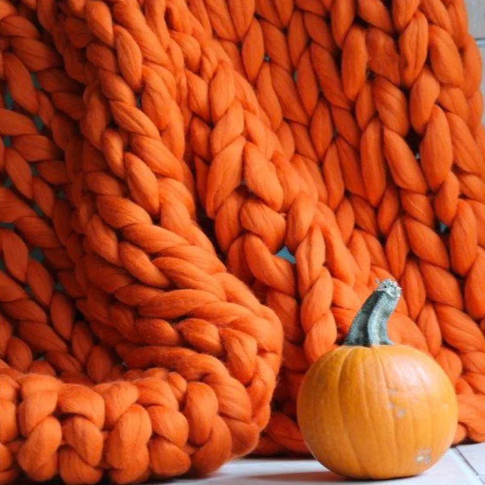 Textured image of large, thick wool yarn, perfect for arm knitting cozy, chunky blankets.
