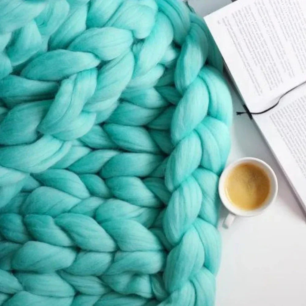 Soft, luxurious chunky yarn in a vibrant color, excellent for DIY cozy blanket projects.