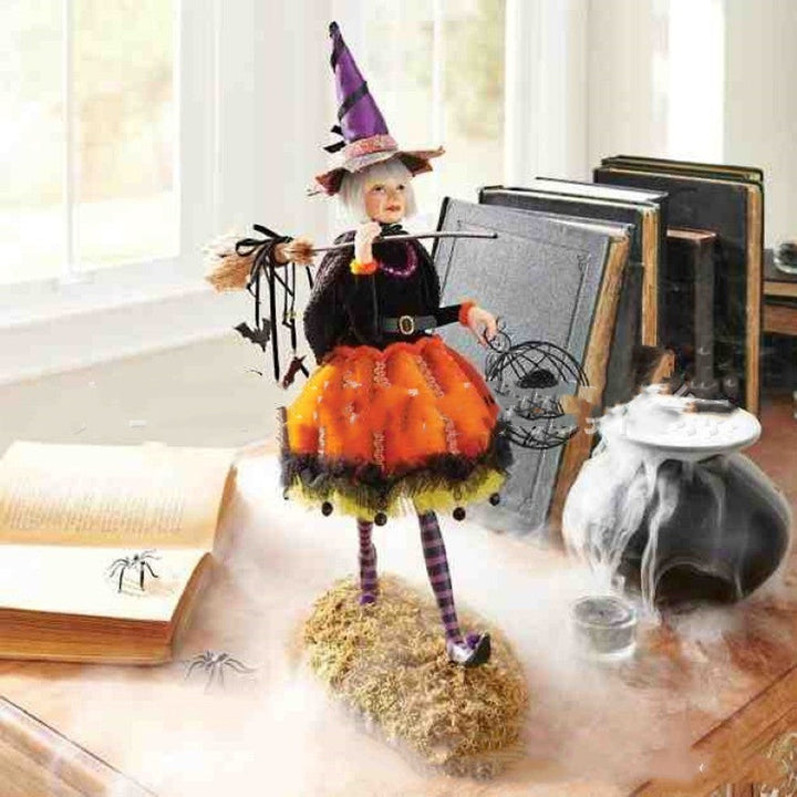 Bewitching Halloween witch figurine, a detailed resin statue for spooky gothic home and table decor.