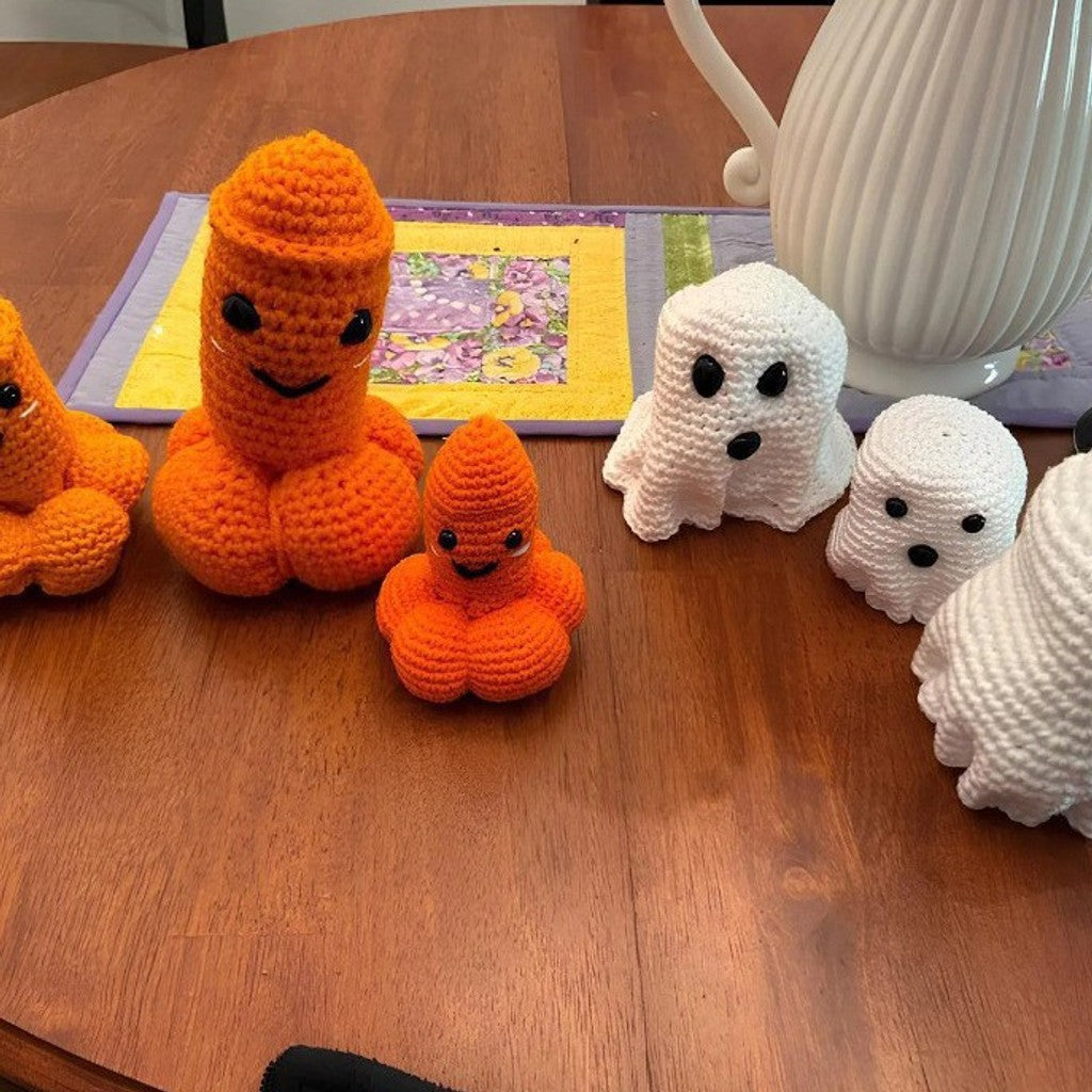 Unique handmade crocheted ghost pumpkin decoration, a charming and modern Halloween seasonal accent.
