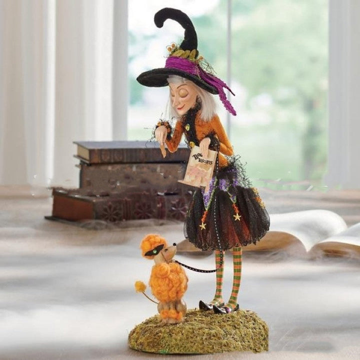 Collectible gothic Halloween witch figurine, a bewitching resin statue for spooky holiday home accents.