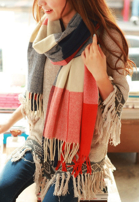 Stylish women's cashmere scarf, a versatile and warm winter fashion accessory.