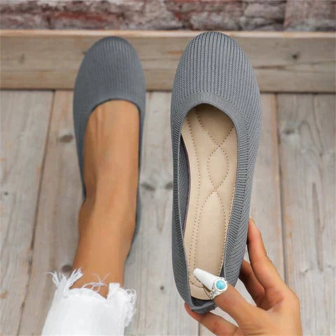 Comfortable ladies slip-on ballet flats, round toe design, ideal for easy, everyday wear.