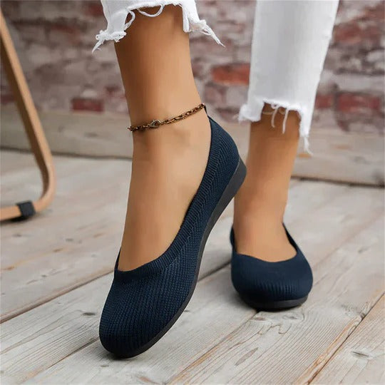 Women's comfortable slip-on ballet flats with a classic round toe, perfect for everyday casual wear.