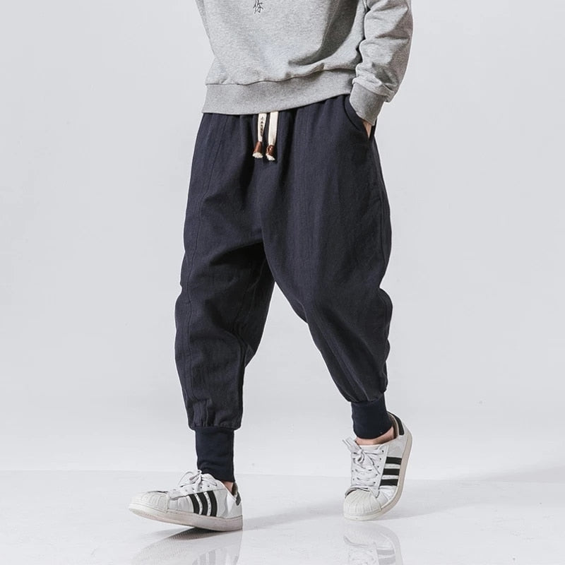 Stylish men's grey cotton harem pants, offering a comfortable, relaxed fit for daily wear.